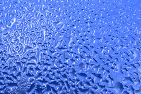 abstract blue natural background: close up of texture on frozen windowの写真素材
