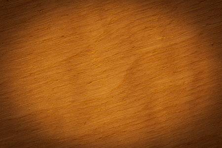 abstract background: close up of wooden board illuminated at centerの写真素材