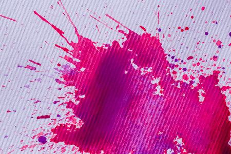 abstract background: close up of purple spots and splashes of paint on striped paperの写真素材