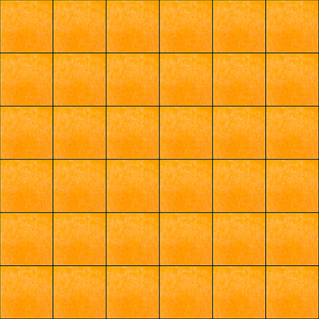 abstract seamless pattern: square cuts of pumpkin against black backgroundの写真素材
