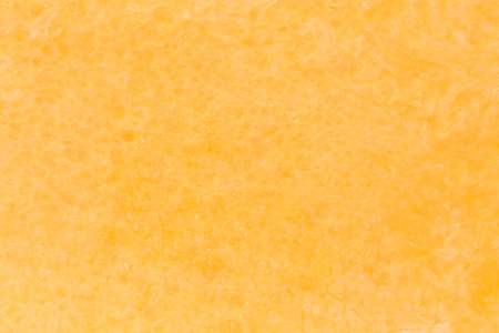 abstract natural background: close up of orange pumpkin pulp textureの写真素材
