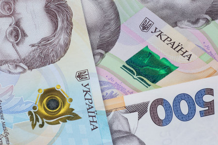 close up of  several of one thousand and five hundreds Ukrainian hryvnias banknotes