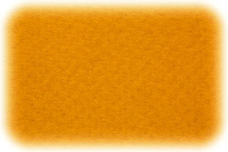 abstract background: close up of orange color textured cardboard with white borderの写真素材