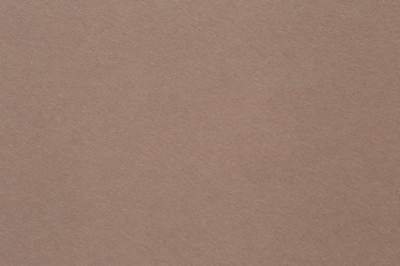 abstract background: close up of blank beige cardboard textureの写真素材