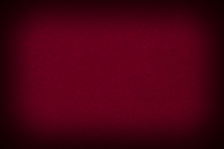 abstract blank backdrop: dark red cardboard with shadowed edgesの写真素材