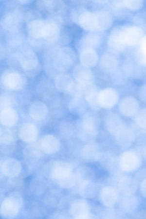 abstract new year holiday background: light blue bokeh backdropの写真素材
