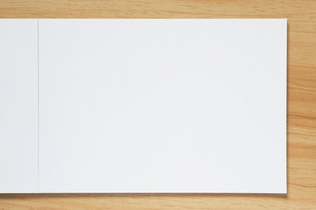 close up of blank page of watercolor album laying on wooden tableの写真素材