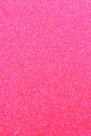 abstract glamour background: close up of pink color glitter textureの写真素材