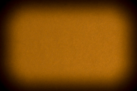 abstract background: close up of blank brown cardboard wall with shadowed borderの写真素材