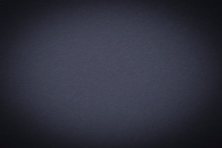 abstract background: close up of ash blue craft cardboard background with shadowed edgeの写真素材