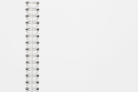 close up of blank page of opened sketchbook with spiral binderの写真素材