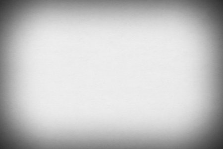 black and white photo of blank sheet of paper with shadowed edgeの写真素材