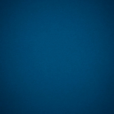 abstract square greetings card backdrop: close up of blue color craft cardboard with shadowed edgesの写真素材