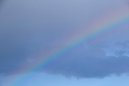 abstract natural background: close up of rainbow in a cloudy skyの写真素材