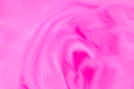 abstract artistic backdrop: close up of stains of pink liquid paintの写真素材