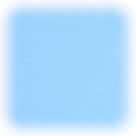 abstract square winter season congratulation card backdrop: close up of light blue cardboard texture with white frameの写真素材