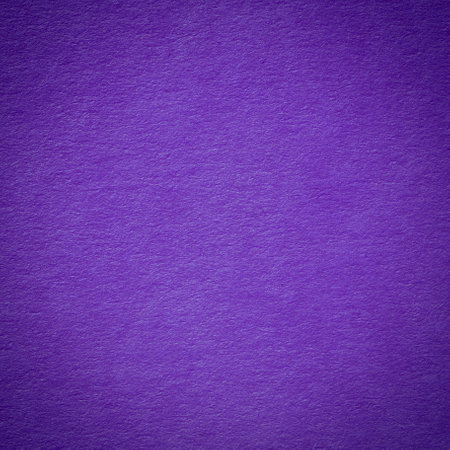 abstract square holiday congratulation card design: close up of violet color cardboard texture illuminated at centerの写真素材
