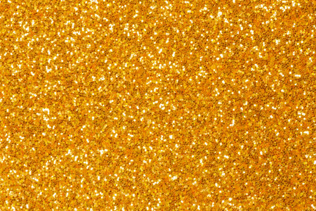 abstract glamour backdrop: close up of golden color glitter textureの写真素材