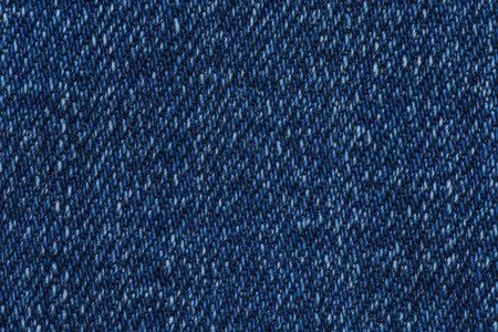 abstract backdrop: close up of blue jeans textureの写真素材