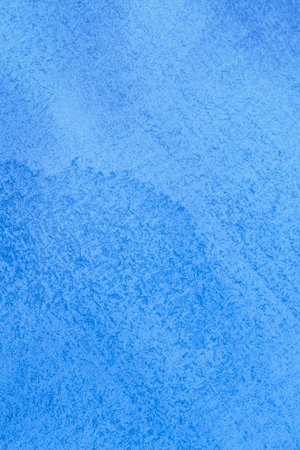 abstract artistic backdrop: close up of canvas stained with blue paintの写真素材