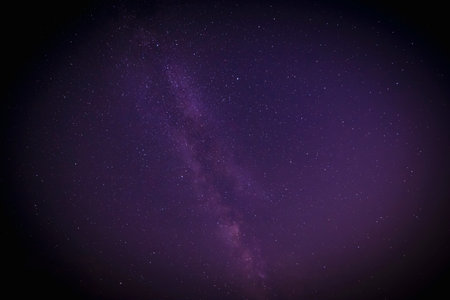 abstract space background with shadowed edge: view on Milky Way galaxy in starlit night skyの写真素材