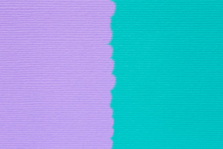 abstract two color cover design backdrop: close up of striped craft paper stained in turquoise and...