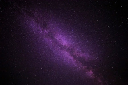 abstract natural background: view on Milky Way galaxy in dark purple night skyの写真素材