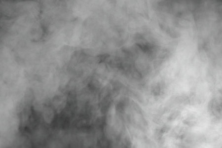 Gray (white) smoke on black backgroundの写真素材