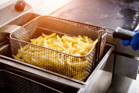The chef cooking french fries. Restaurant.の写真素材