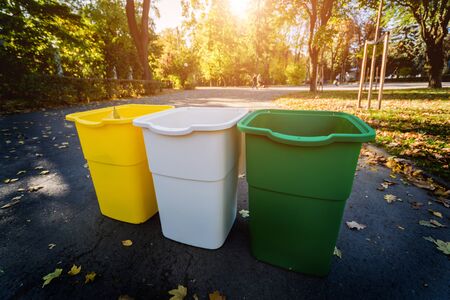 Three trash containers in different color, for sorted waste. Outdoorsの写真素材