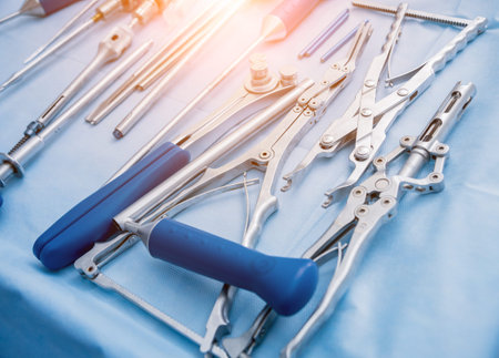 Sterilized surgical instruments and tools on the blue table. A spine surgery equipment. Medical...