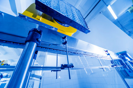 The plastic bottle blowing machine. PET preforms for blowing of plastic bottles. Heating process....