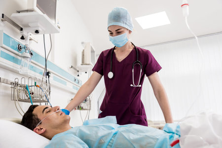 Doctors give resuscitation to a male patient in the emergency room.