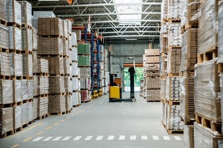 Warehouse industrial company. Commercial warehouse. Crates stacked on the shelves. Industrial backgroundの写真素材