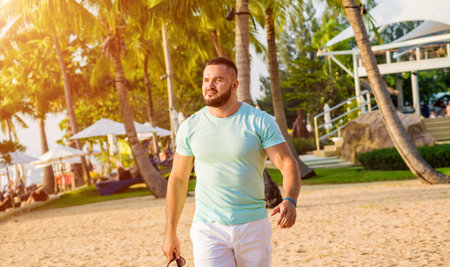 Young man on a tropical beach. Summer