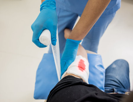 Nurse dressing wound for patients hand with deep skin cutting.の写真素材