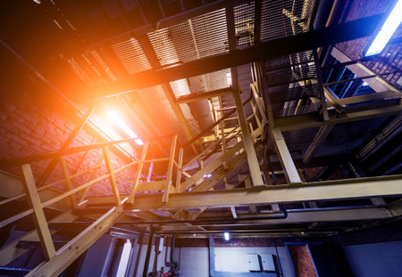 Interior of modern natural oil factory. The piping, pumps and motors