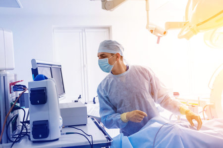 Spinal surgery. Group of surgeons in operating room with surgery equipment. Laminectomy. Modern...