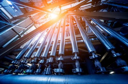 Interior of modern natural oil factory. The piping, pumps and motorsの写真素材