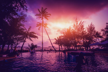Beautiful tropical beach with palm trees. Sunrises and sunsets. Oceanの写真素材