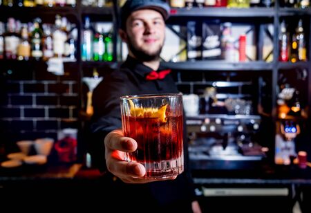 Bartender is making cocktail at bar counter. Fresh cocktails.の写真素材