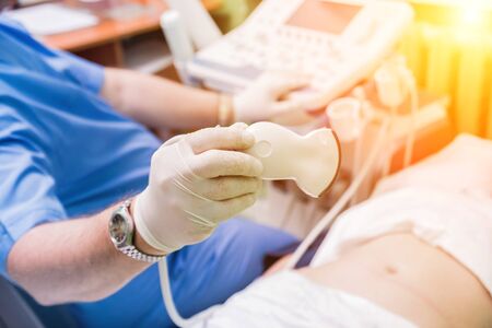 Ultrasound scanner in the hands of a doctor. Diagnostics. Sonography.の写真素材