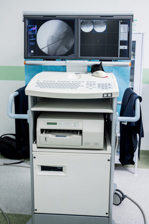 Process of trauma surgery operation. Group of surgeons in operating room with surgery x-ray...