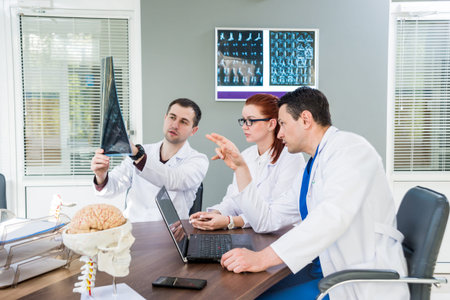 Doctors team having medical council in hospital.