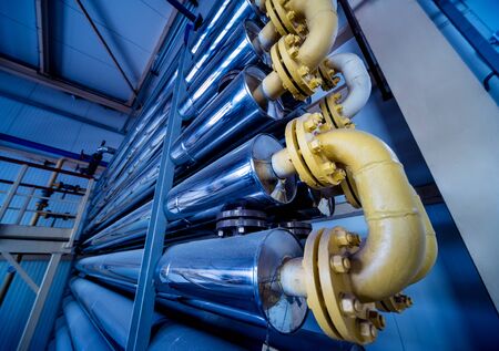 Interior of modern natural oil factory. The piping, pumps and motorsの写真素材
