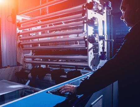 Modern automated production line in factory. Plastic bag manufacturing process. Backgroundの写真素材