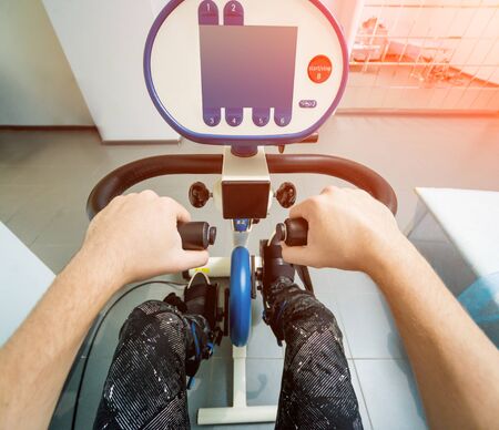 Restoration and rehabilitation of limb movement. Exercise bike.の写真素材