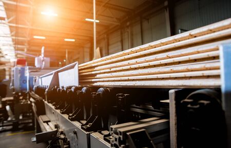 Production line of the wooden floor factory. CNC automatic woodworking machine.の写真素材