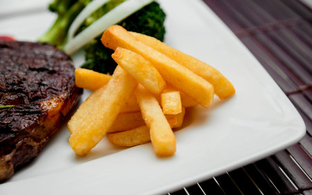 Roasted potato on the white plate. Barbecue. Restaurant
