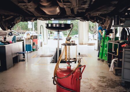 Engine oil change. Car and repair. Service station.の写真素材